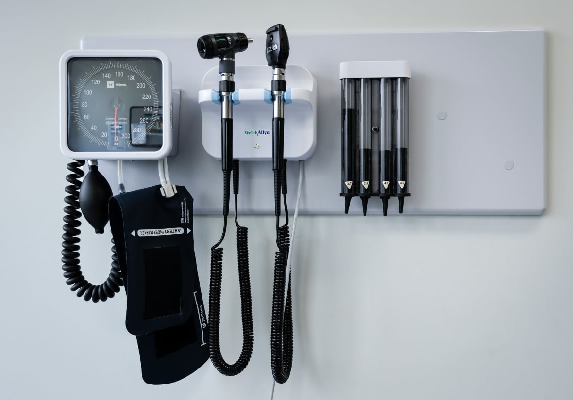 alta-health-doctors-20231102 Medical tools hang from the wall of a doctor's office.