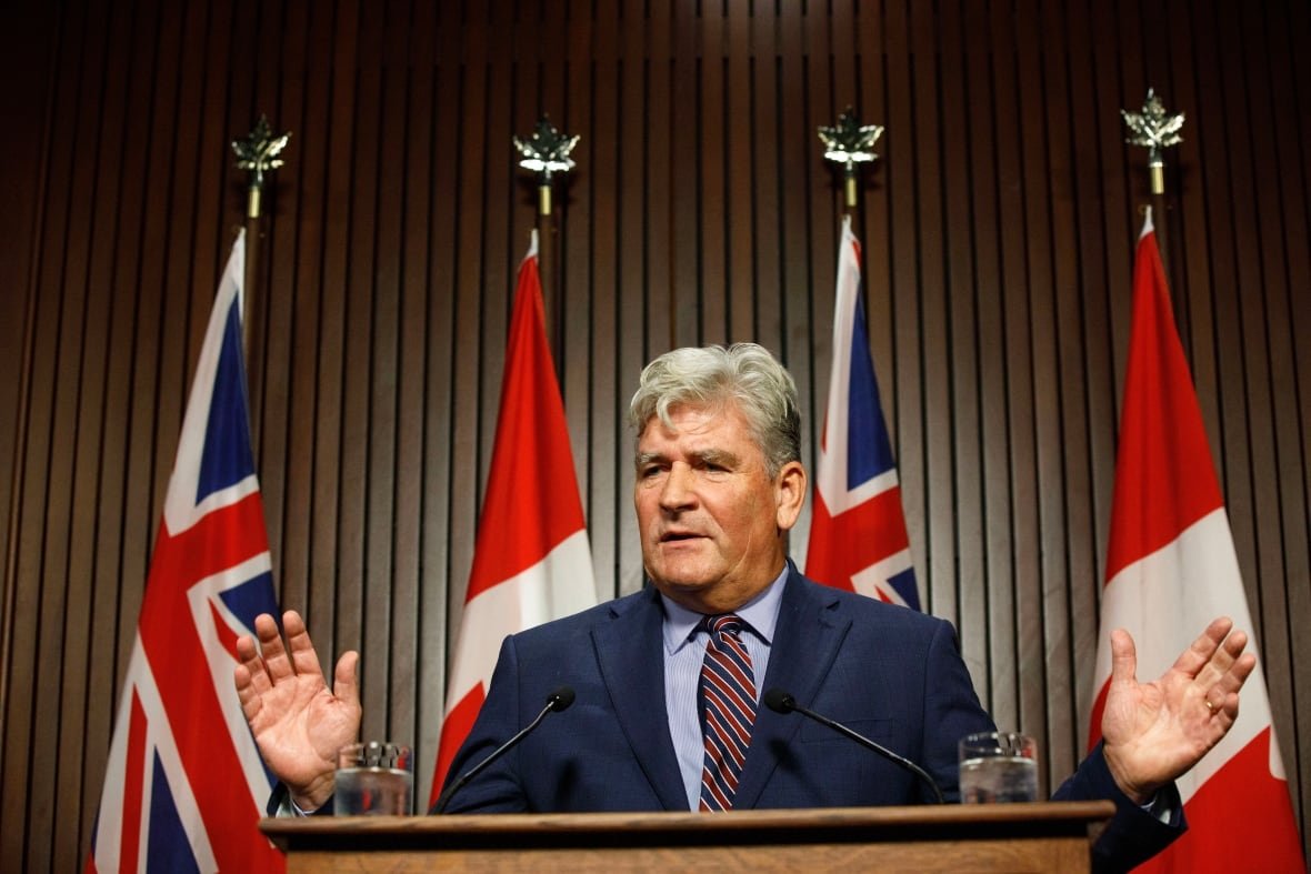 august-2023-file-photo-of-ontario-liberal-mpp-john-fraser The Ontario Liberal's John Fraser stands behind a podium.