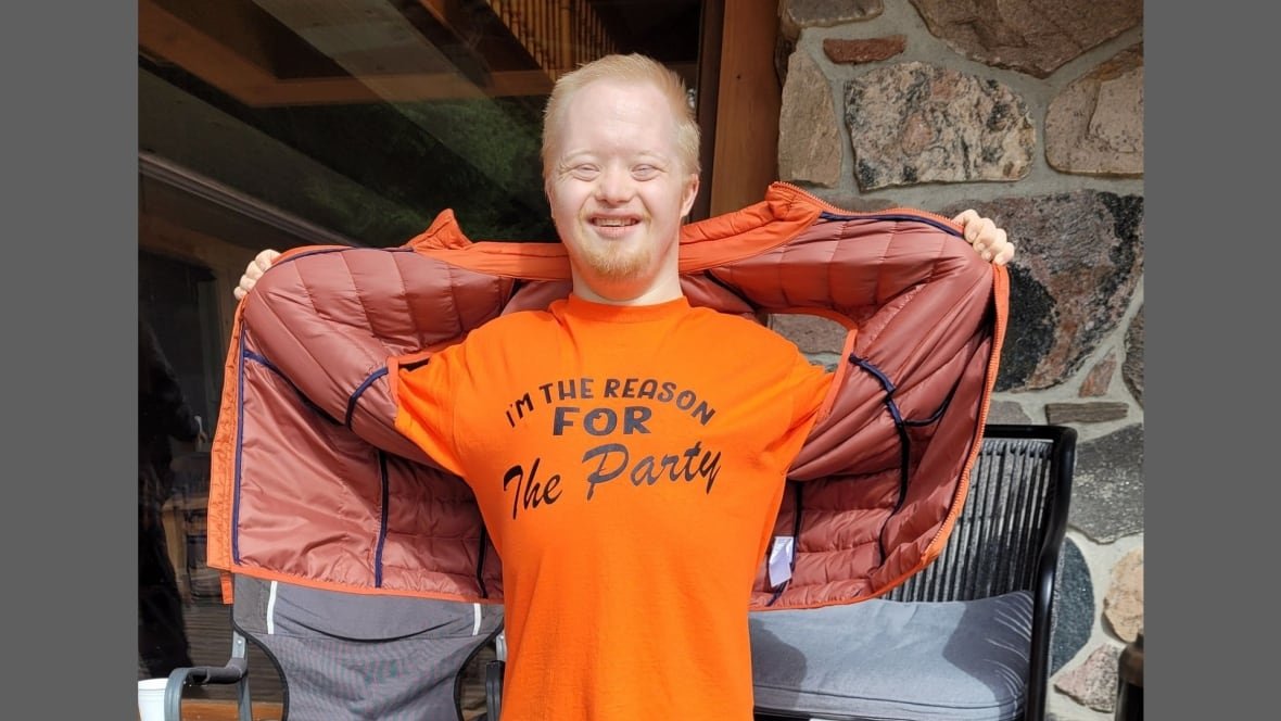 austin-clapp-2 An individual with Down Syndrome smiles for the camera.