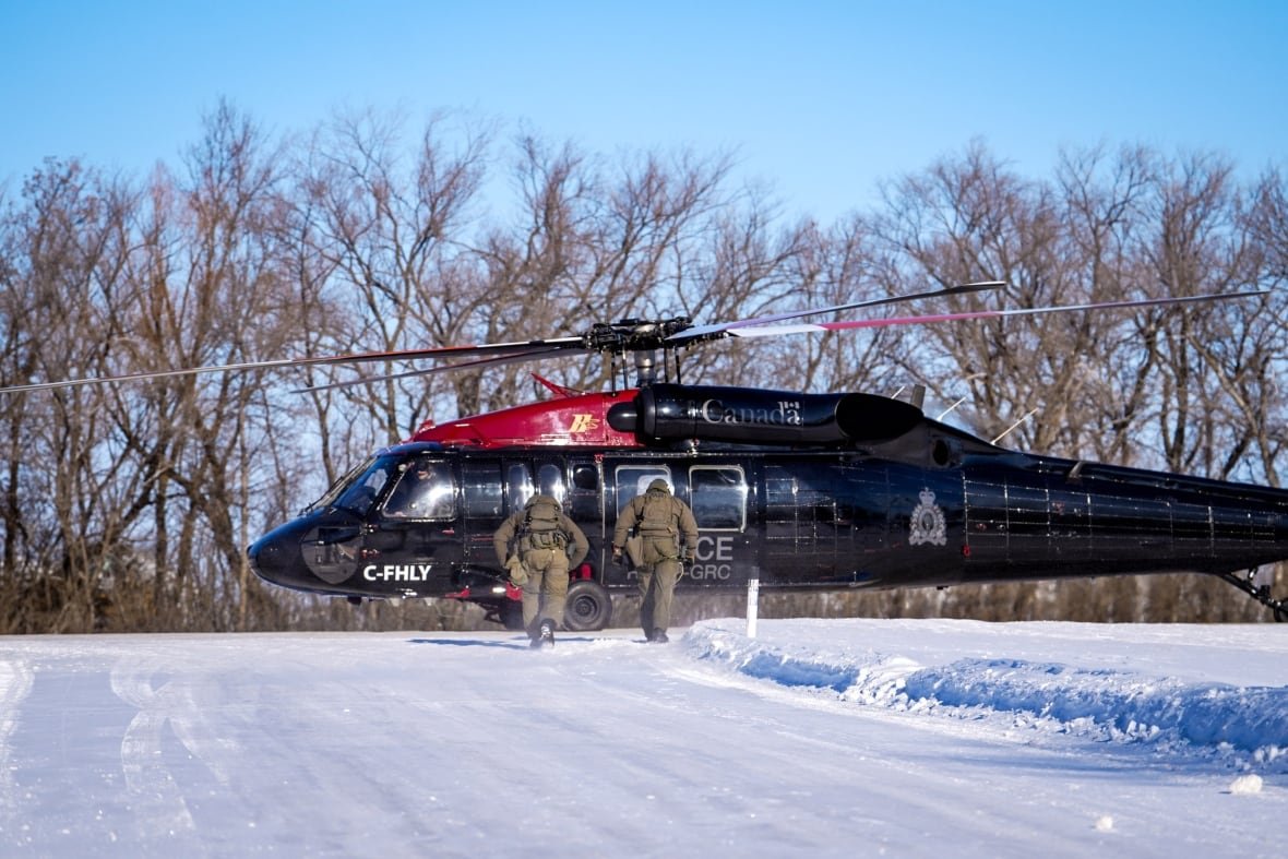 A chopper is grounded in winter.