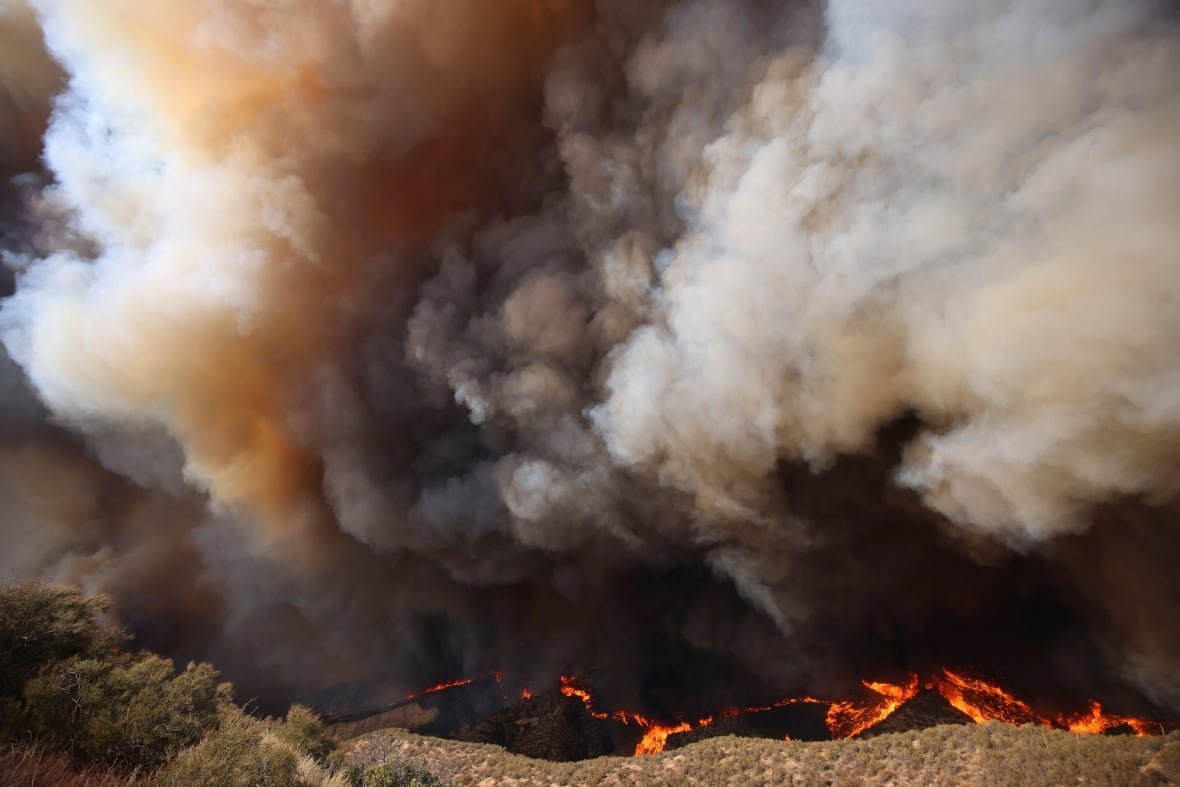 california-wildfires-48 Plumes of smoke rise from a wildfire.