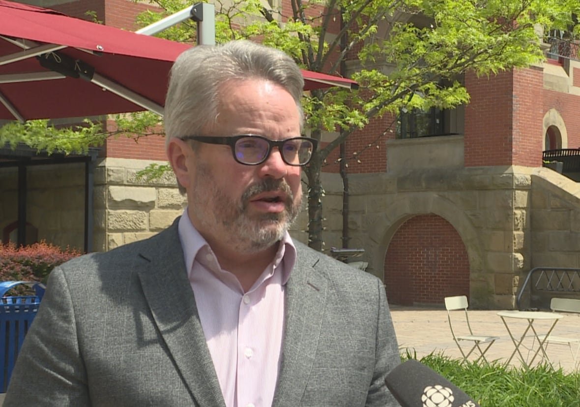 David Campbell stands outside Fredericton city hall.