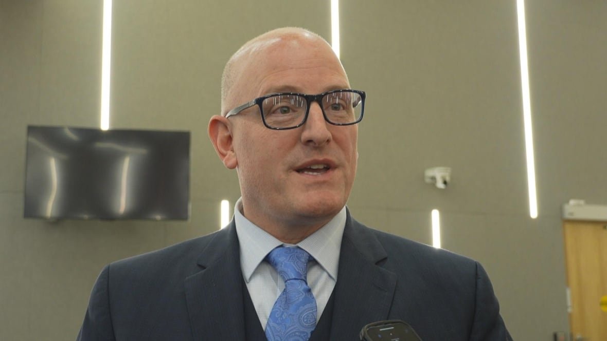 Head shot of Dilkens talking to reporters.