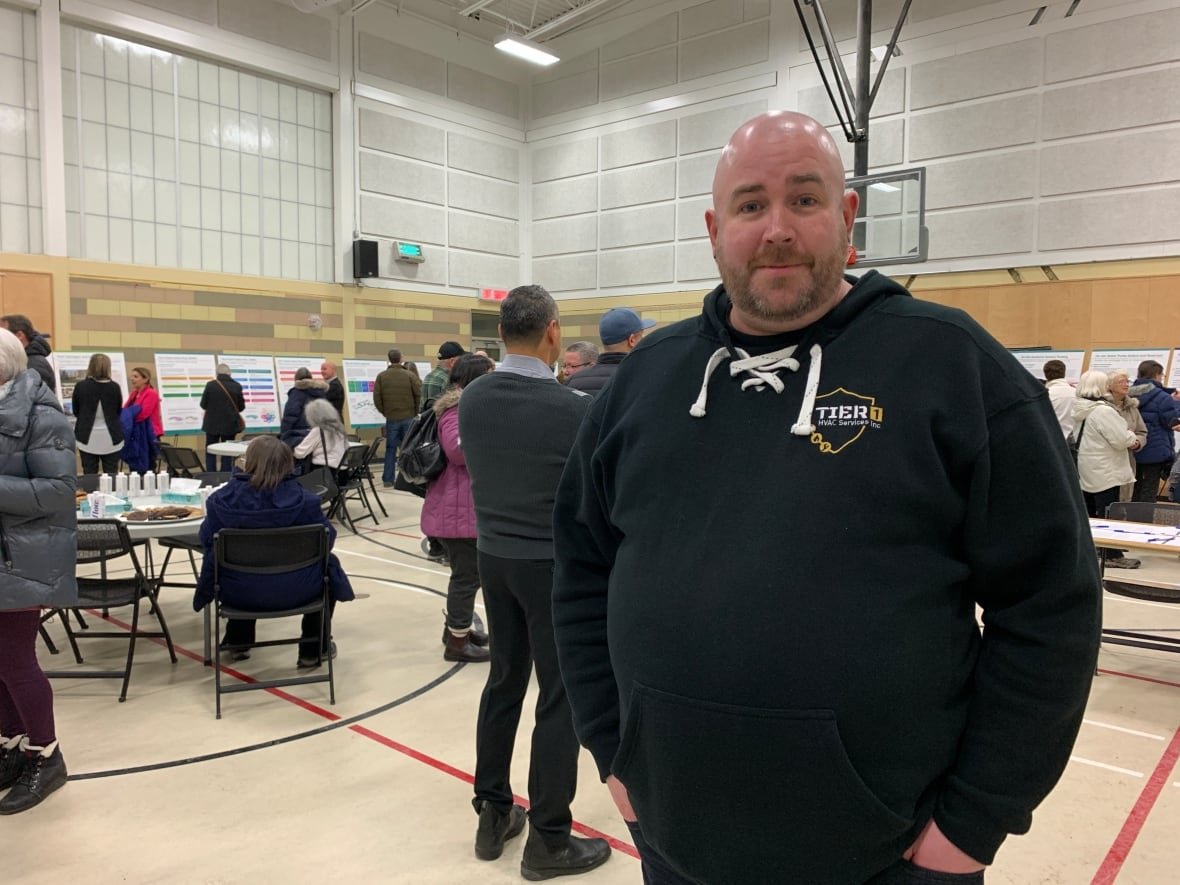 jonathan-mclellan-tewin-open-house-jan-9-2025 A man standing at an open house event.