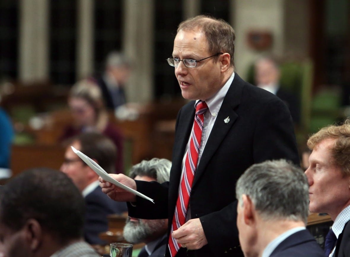 A man in a suit and tie speaking in the House of Commons.