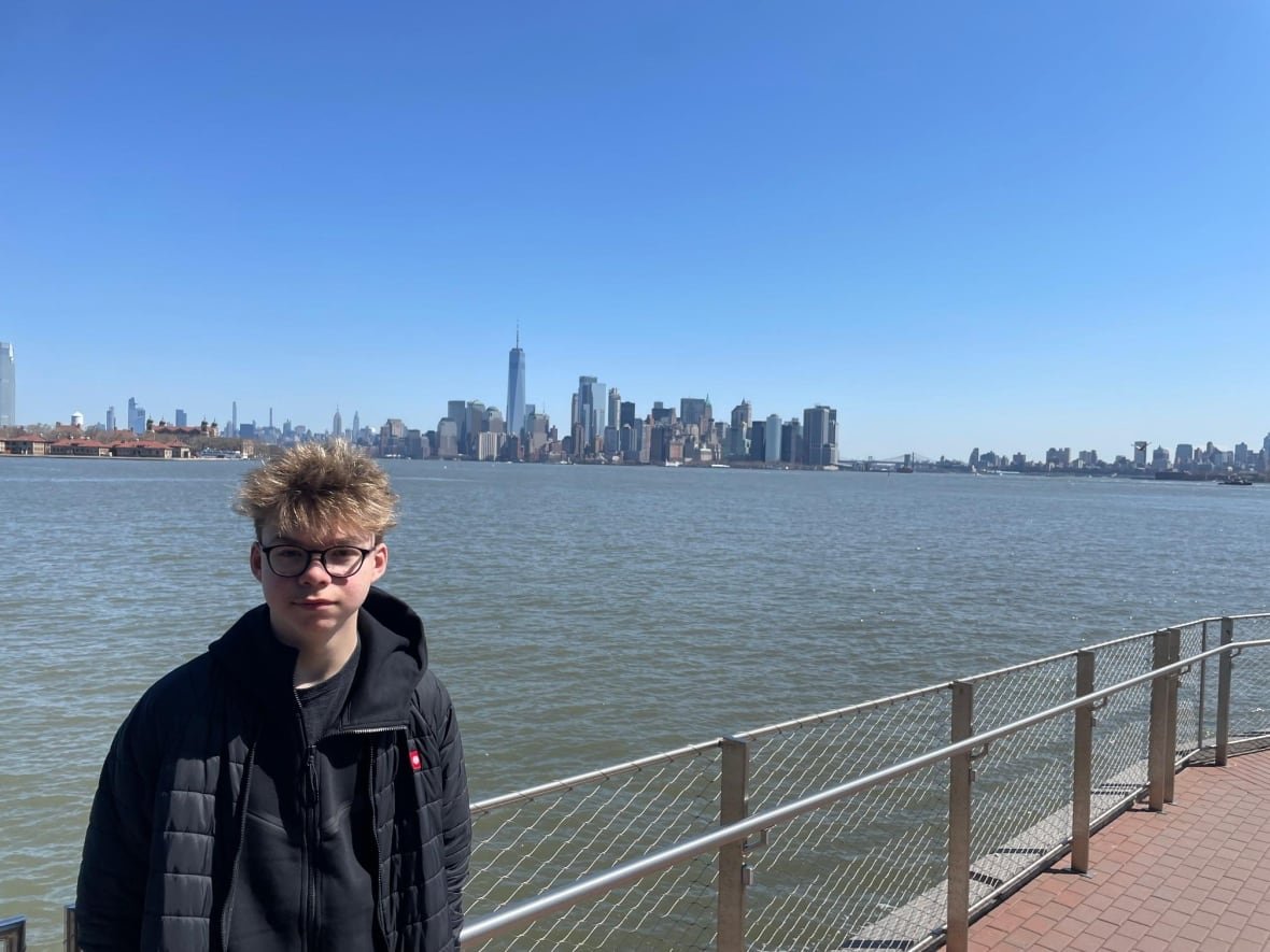 mathis-boivin a boy posing in front of a New York City's skyline