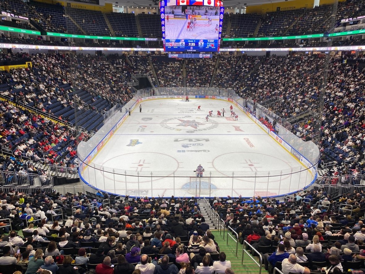 qc-pee-wee-tournament-crowd a wide shot of a packed hockey arena