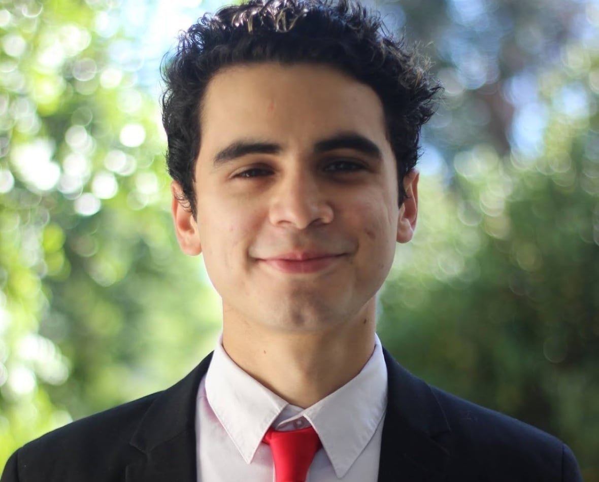 Young man in red tie