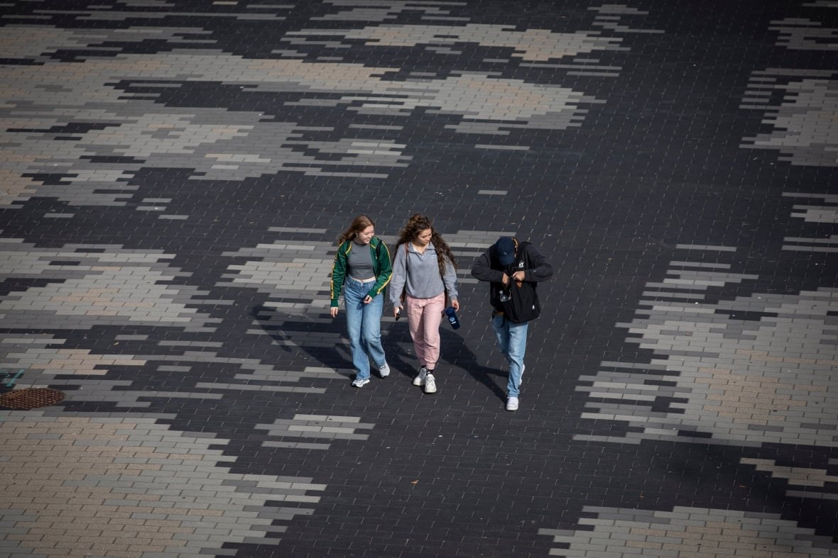 ubc-back-to-school Three students walk across campus.