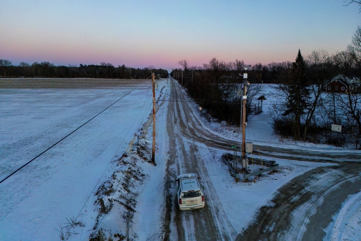 usa-trump-migration-canada-1 A drone views shows a U.S. Border patrol guard stationed along the the concrete blocks which mark the international border between the U.S. state of Vermont and the Canadian province of Quebec, near Alburgh, Vermont, U.S., January 20, 2025.