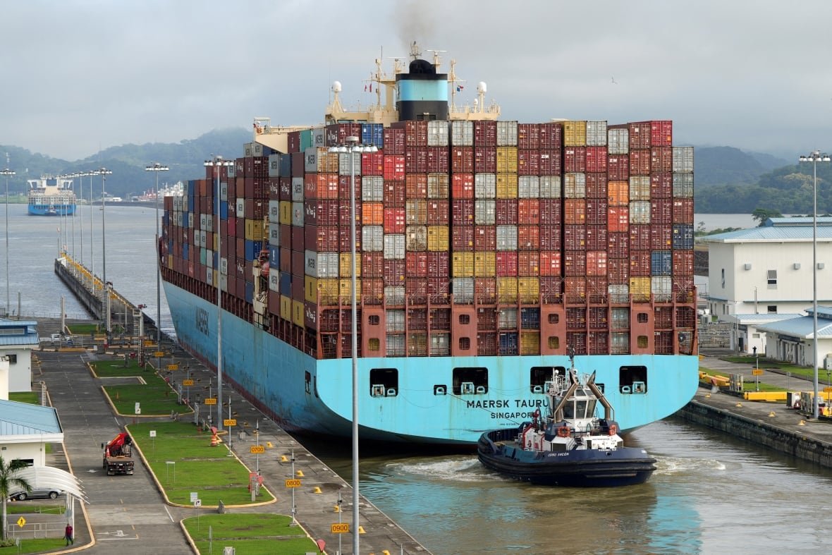 usa-trump-panama A container ship transit through a canal.