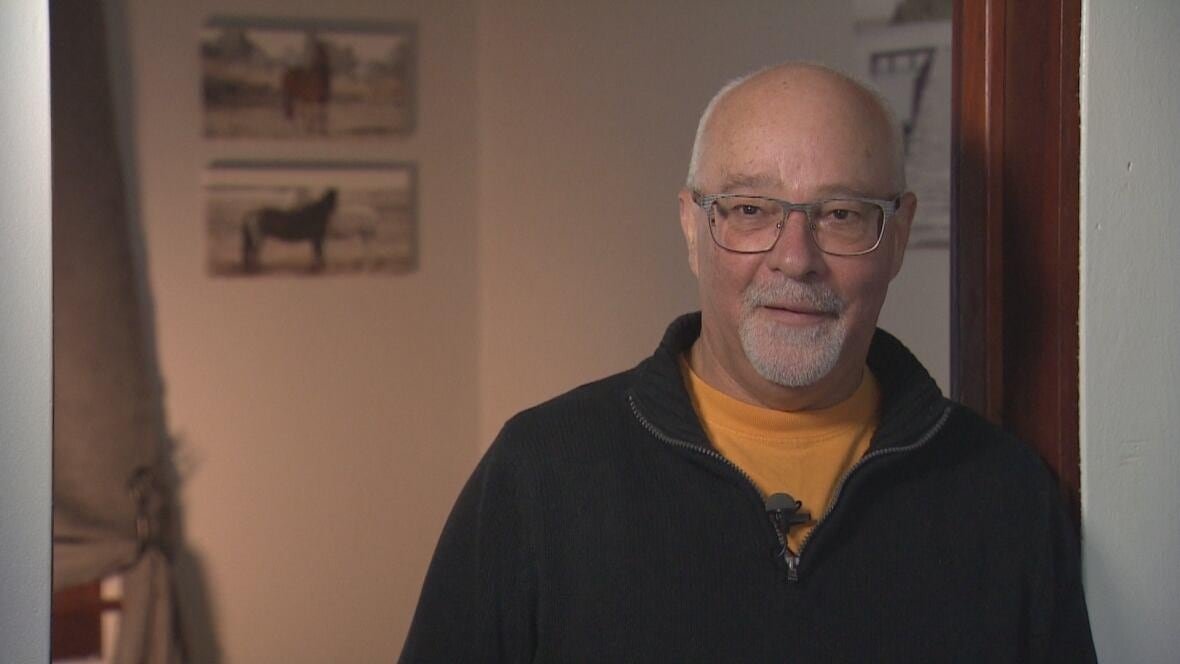 warren-maddox Man with white hair and beard wearing glasses, dressed in casual jacket.