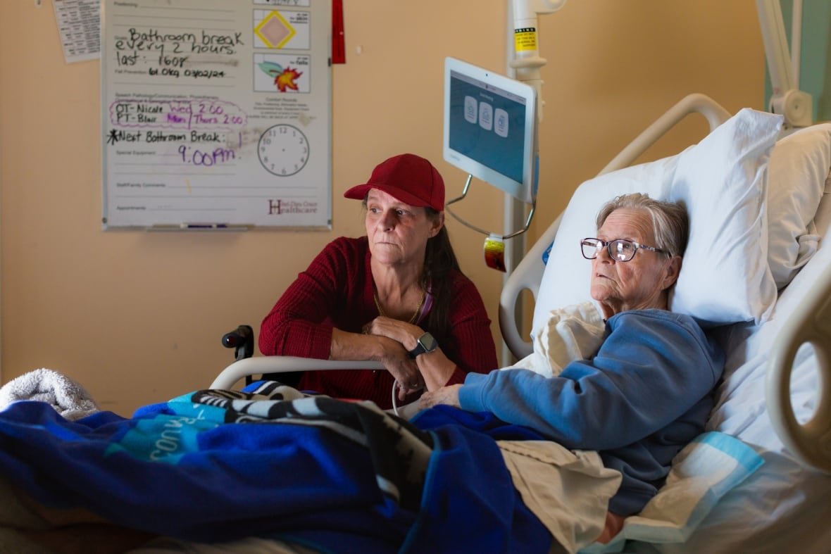 Michele Campeau, left, visits with her mother, Ruth Poupard, 83, at Hotel-Dieu Grace Healthcare in Windsor on April 3, 2024.