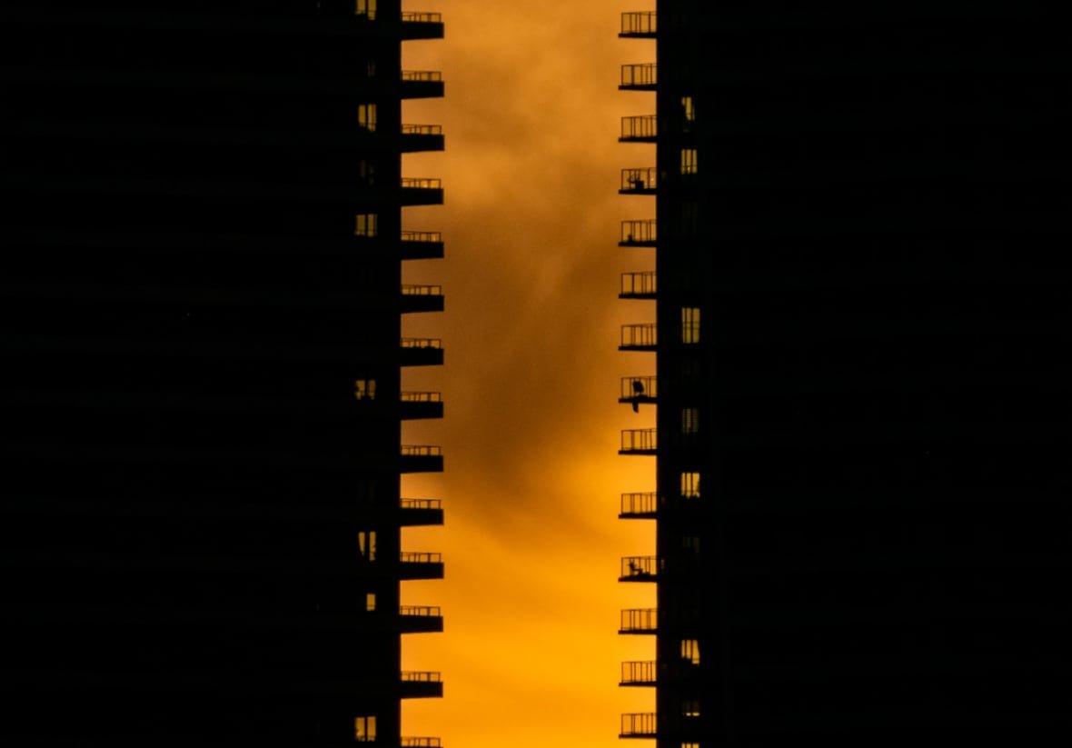 canadian-geographic-5 The late afternoon sun paints the sky a moody apricot between the looming silhouettes of two condo towers