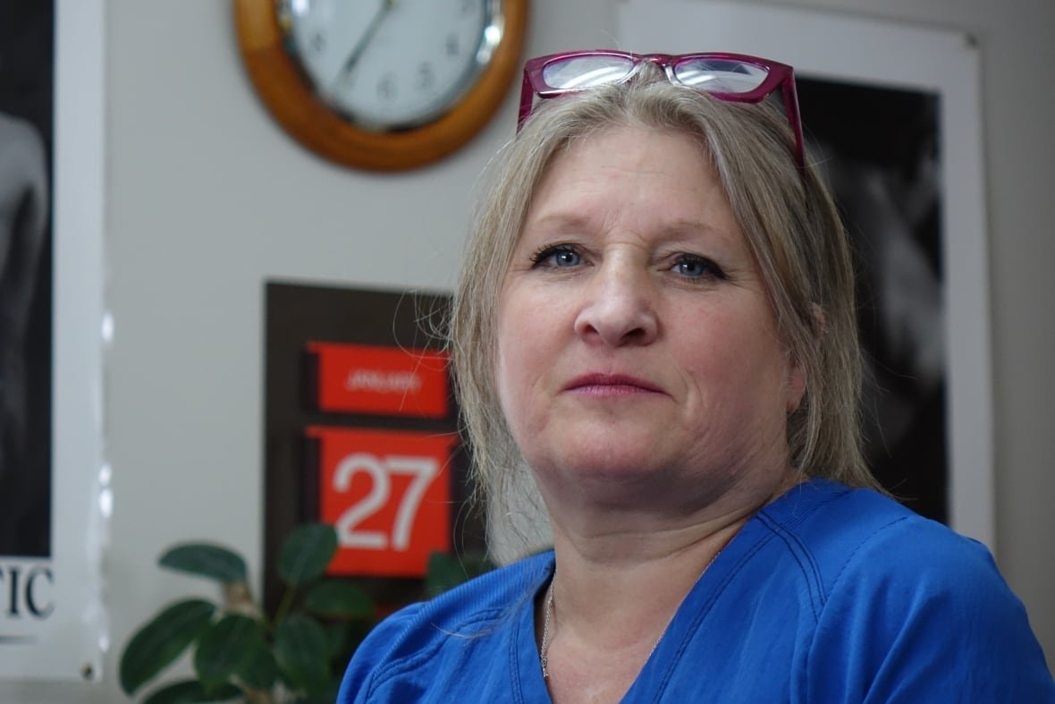 debbie-brake-patten A woman in a blue shirt with blonde hair.