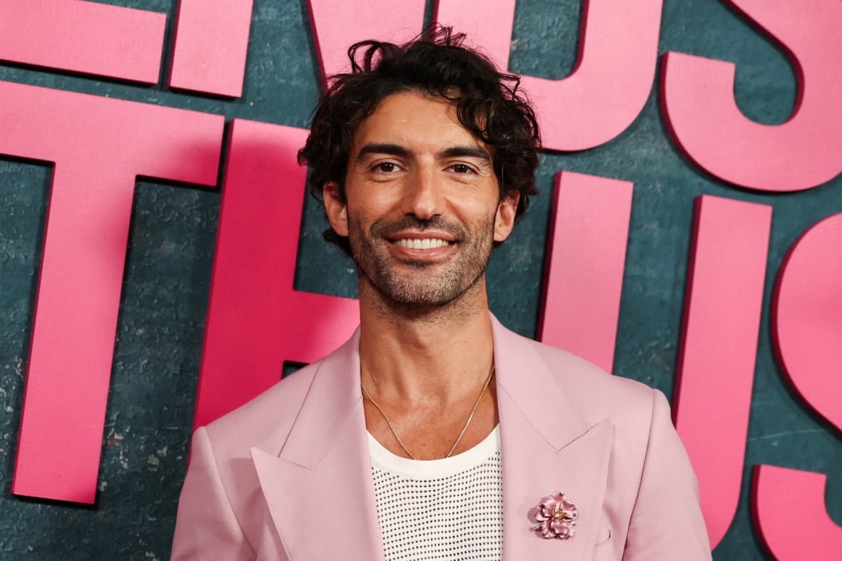 A man smiles for a photo.