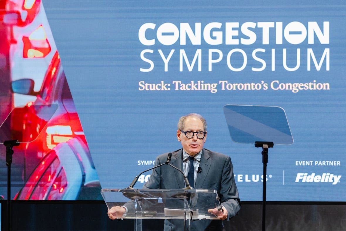 Man standing at a podium.