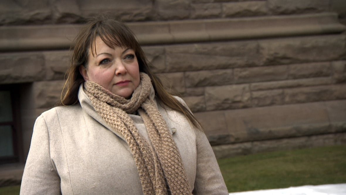 Close up photo of Natalie Mehra wearing a jacket and scarf.