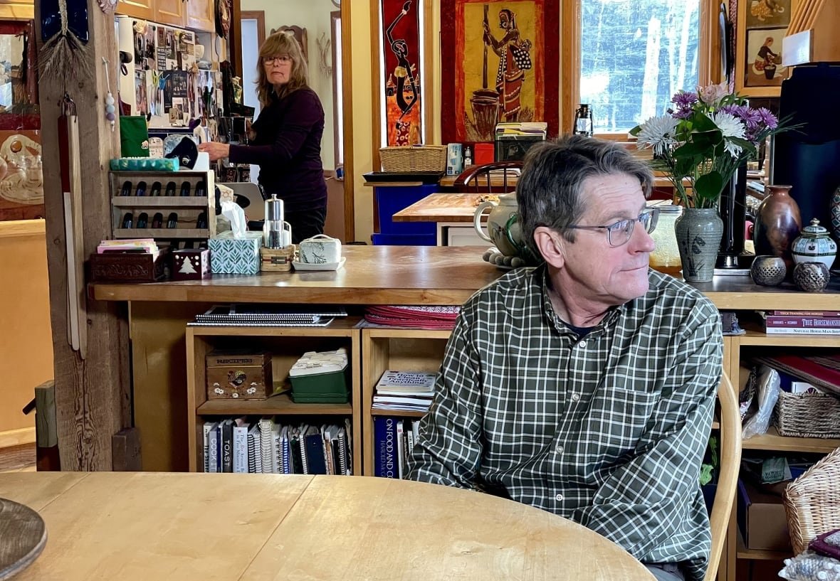 Two people in their kitchen.