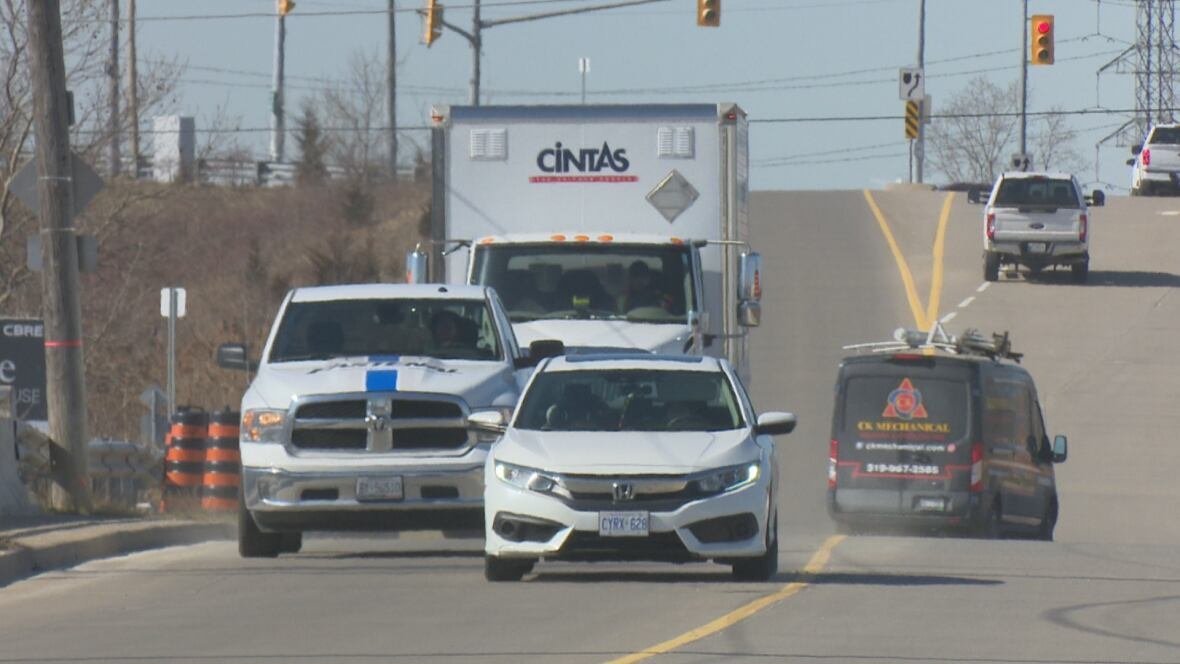 twin-oaks-drive-1 Multiple vehicles on a roadway.