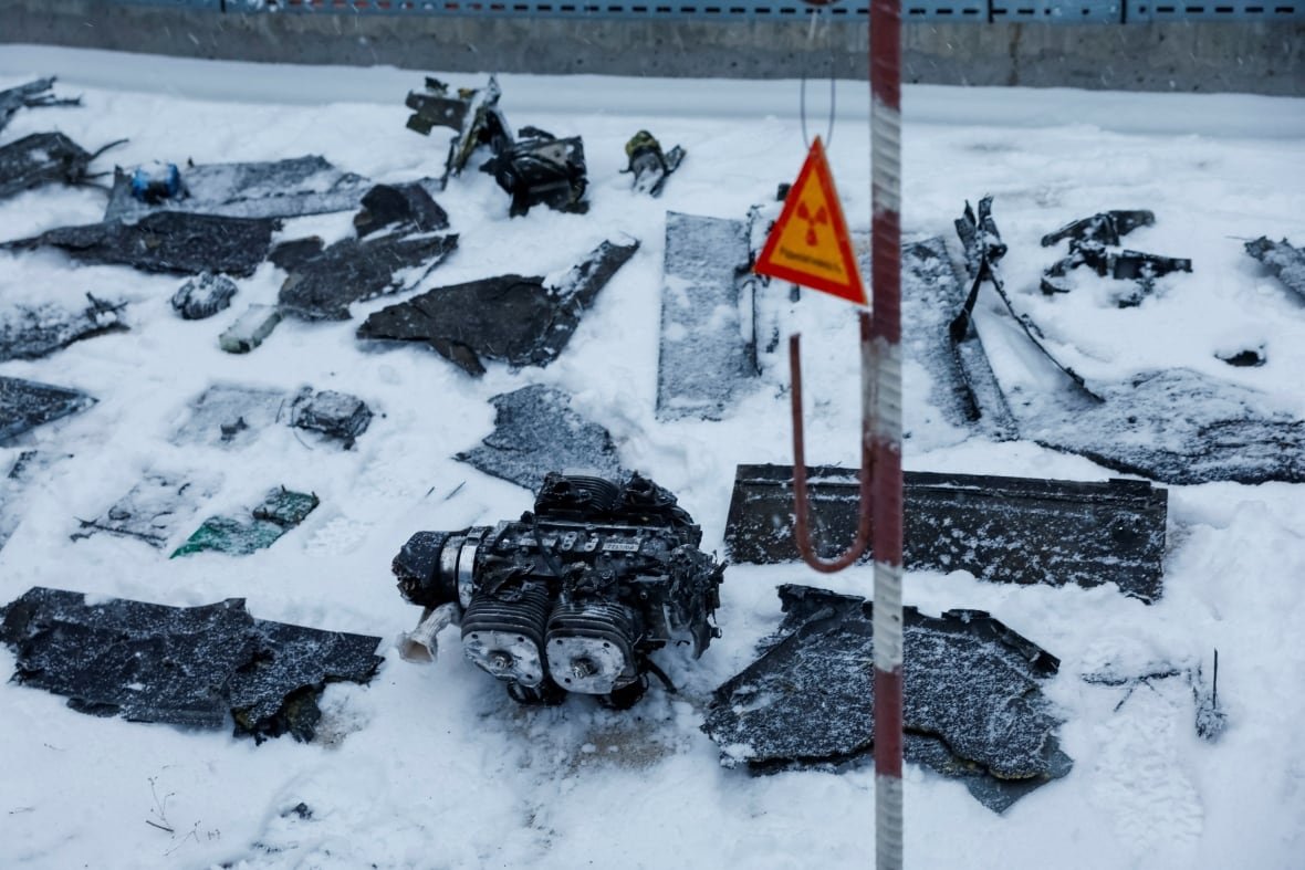 ukraine-crisis-attack-chornobyl-3 Parts of a drone are seen near a New Safe Confinement (NSC) structure, that covers the old sarcophagus which confines the remains of the damaged fourth reactor and bears an impact of what Ukrainian President Volodymyr Zelenskiy says was a Russian drone strike, amid Russia's attack on Ukraine, at the Chornobyl Nuclear Power Plant, in Kyiv region, Ukraine.