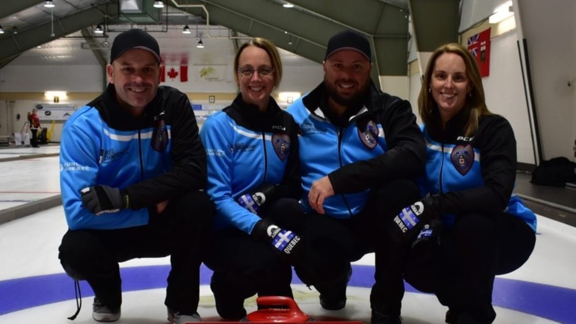 56346758567 A curling team poses for a group photo.