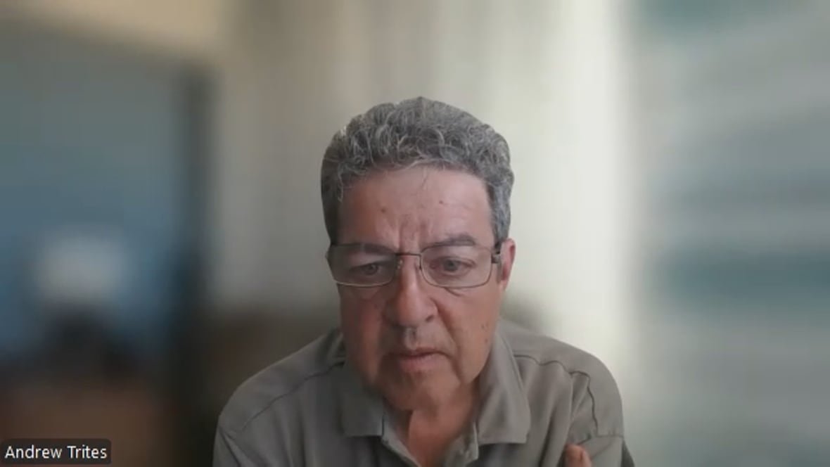 A man in glasses during zoom call.