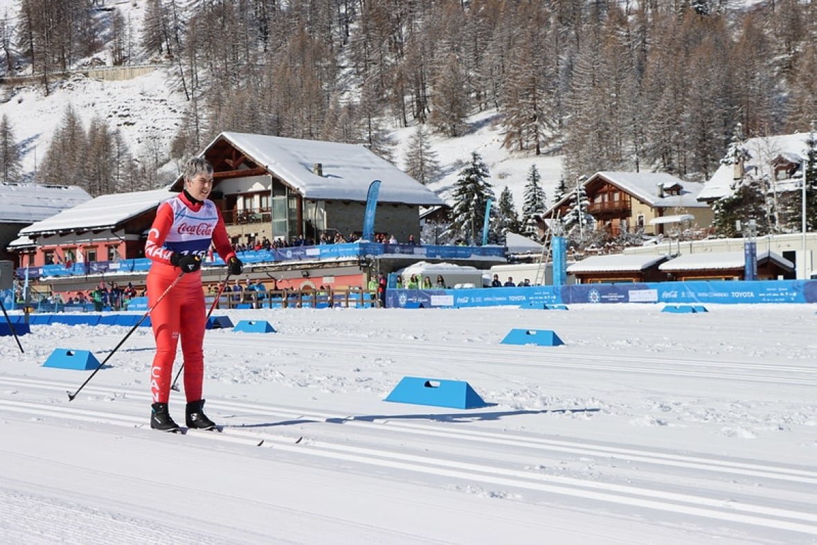 brita-hall A woman skis through the snow.