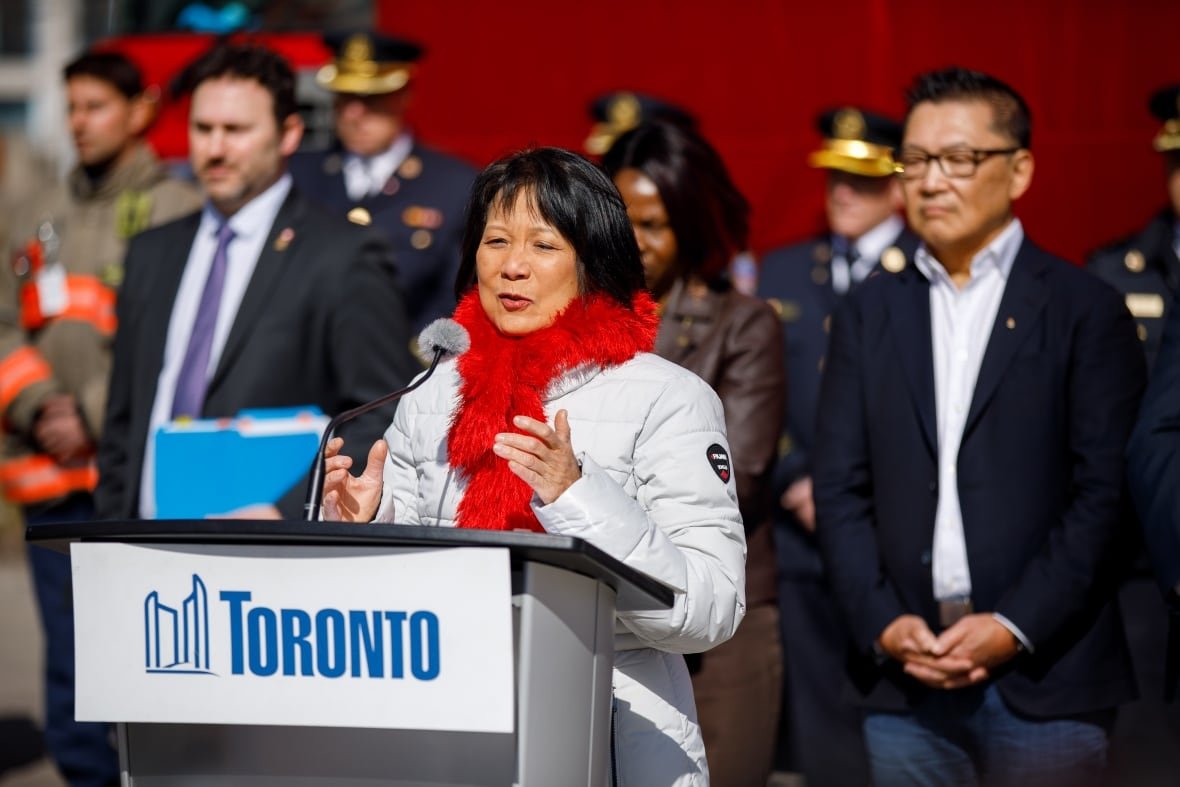 chow-u-s-tariffs A woman speaks at a podium