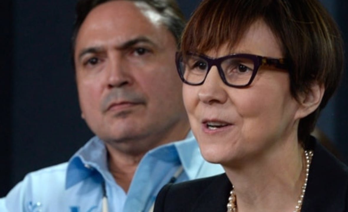 cindy-blackstock A woman and a man at a press conference.