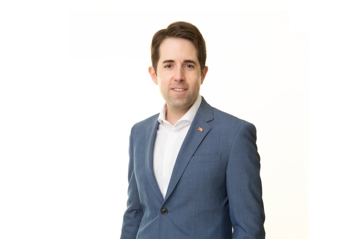 colin-mang-economist-at-mcmaster-university Man in a suit.