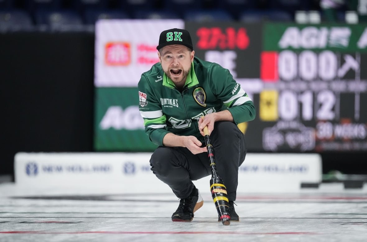 cur-men-brier-20250301-1 A curling athlete, dressed in green, crouches low and shouts with intensity.