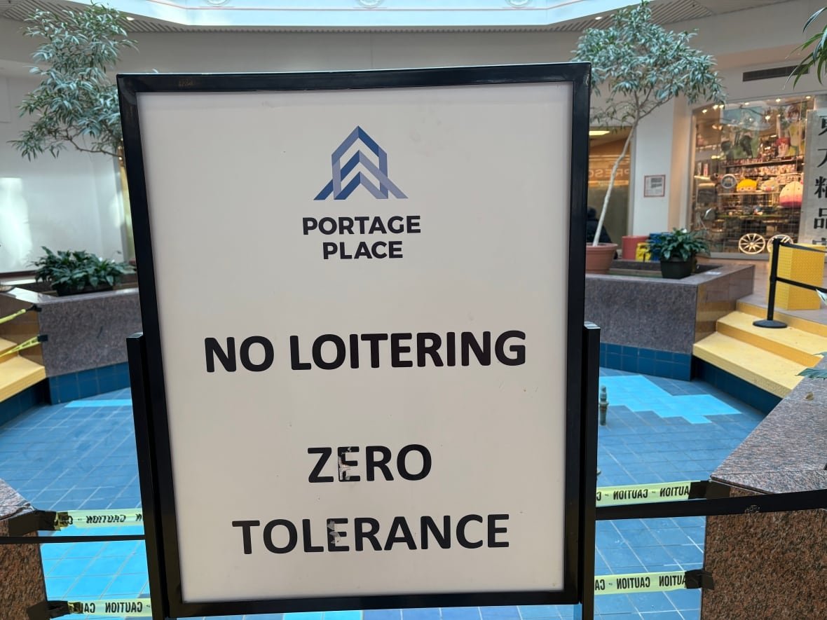 decommissioned-water-fountain-at-portage-place A sign reading no loitering - zero tolerance is posted in front of an old water fountain
