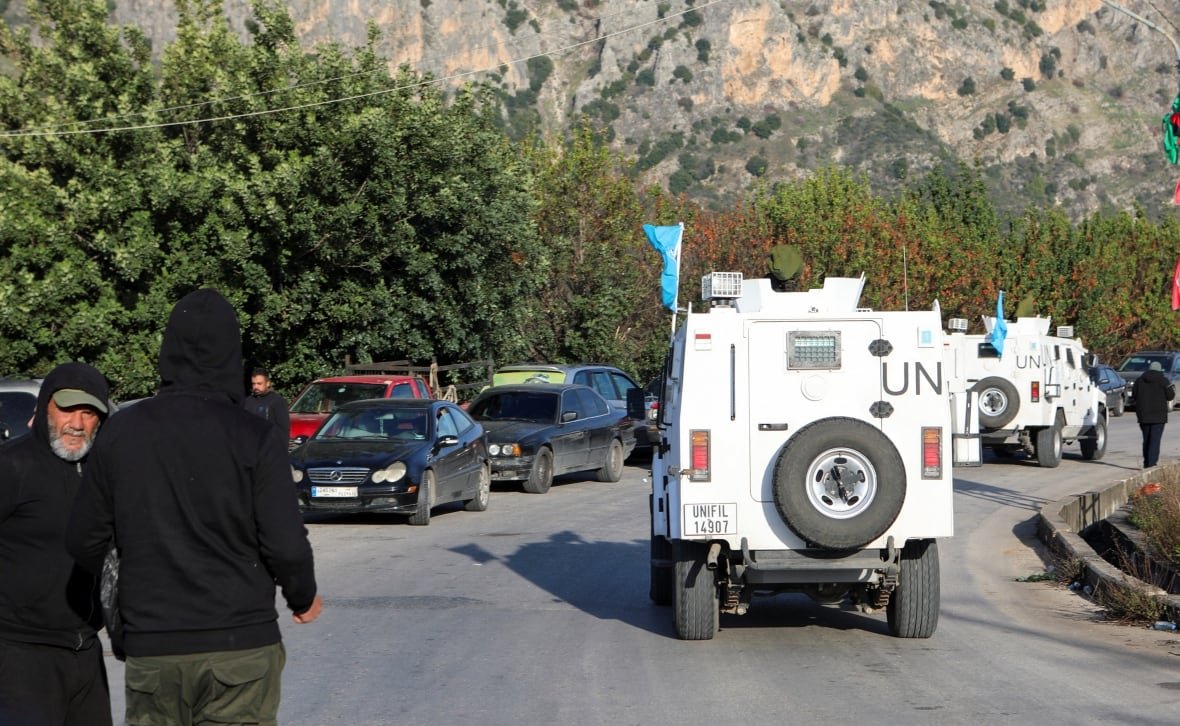 israel-palestinians-lebanon-withdrawal-4 UNIFIL vehicles drive by.
