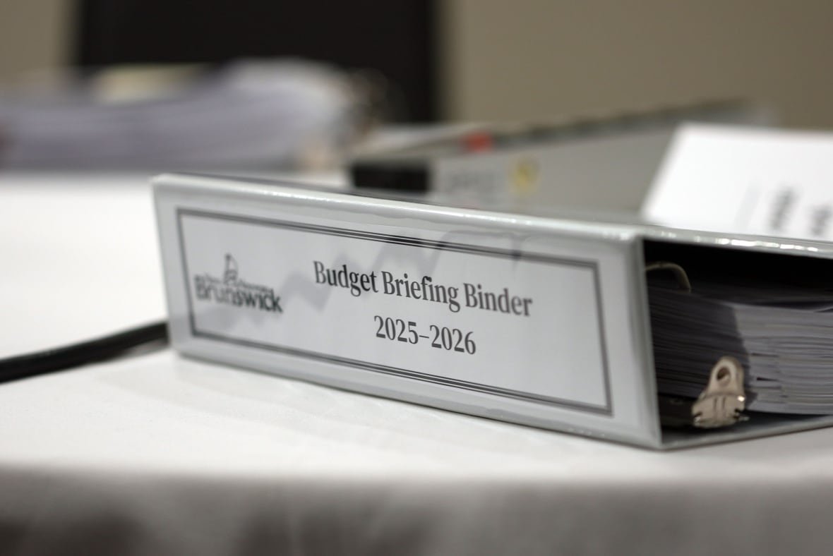 n-b-budget-briefing-binder-2025-26 A thick, grey binder that says "Budget Briefing Binder 2025-2026" on the side.