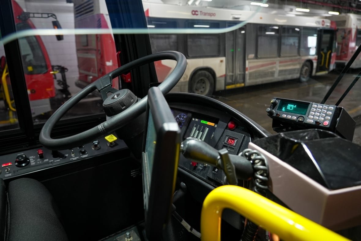 new-flyer-electric-bus-driver-area-ottawa-display-jan-30-2025-ebus A bus seat with coloured digital display