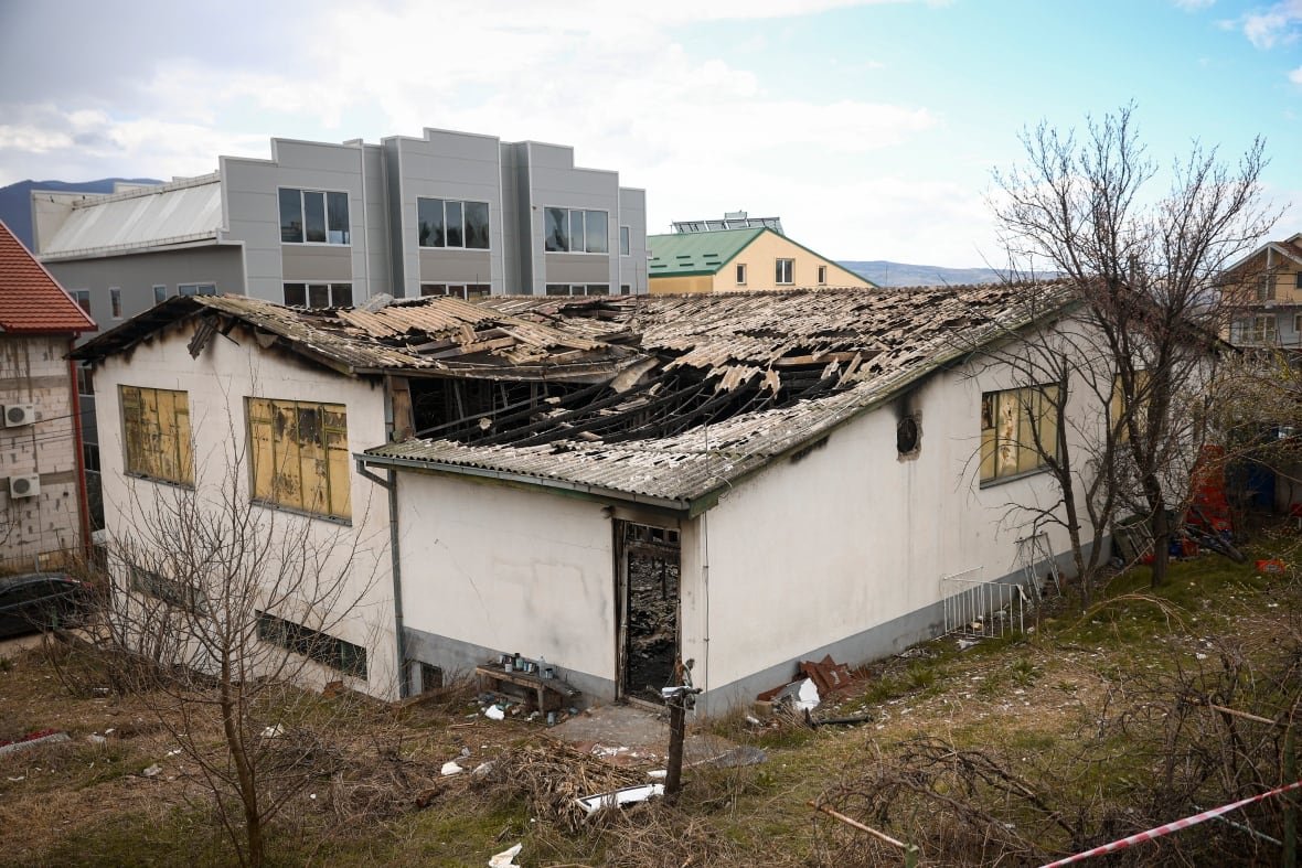 north-macedonia-nightclub-fire-1 The damaged rickety roof of a one-storey building is shown.