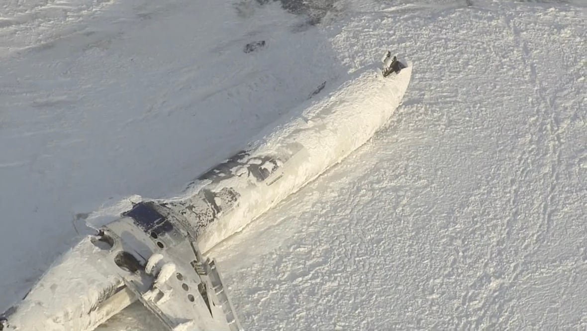 The wreckage of a Delta Air Lines flight 4819 is seen on the tarmac of Pearson International Airport, in Toronto, in a Tuesday, Feb. 18, 2025, still image made from handout video footage.