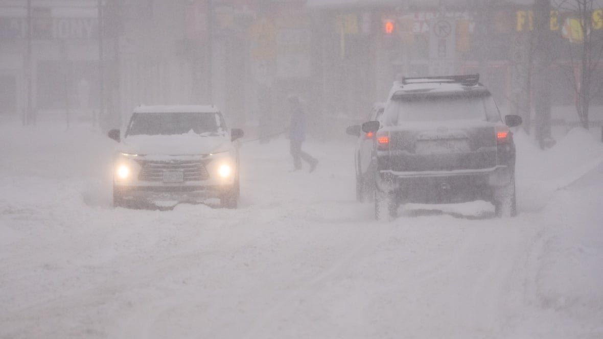Three cars on a snowy road