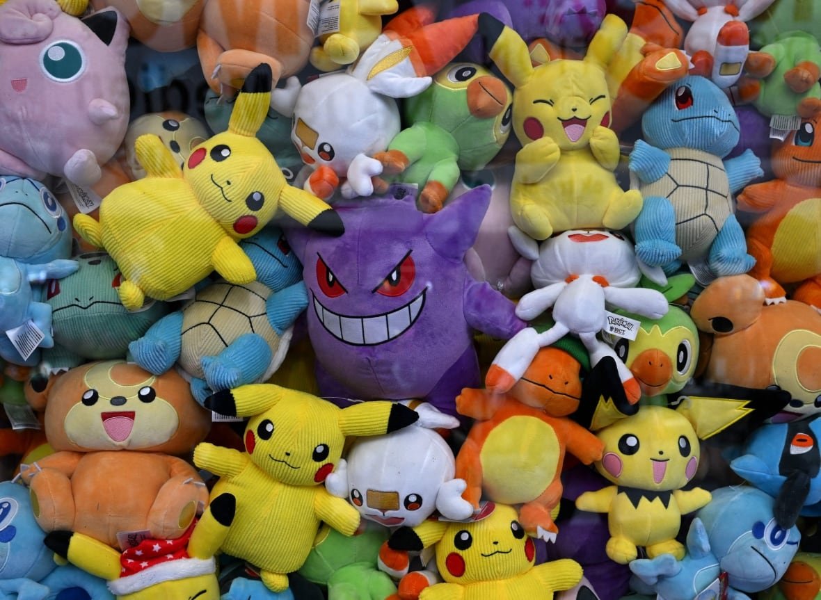 Many stuffed Pokemon toys.