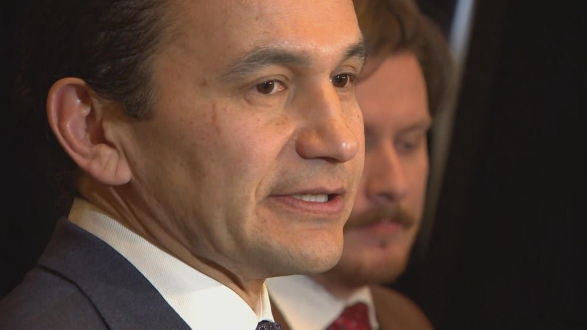 premier-wab-kinew A man in a suit speaks.