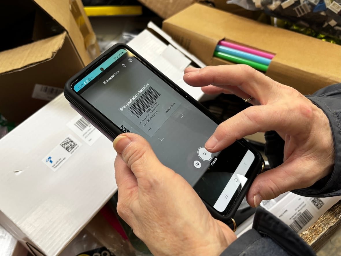 scanning-barcode-while-bin-shopping A phone camera scans the barcode on a box.