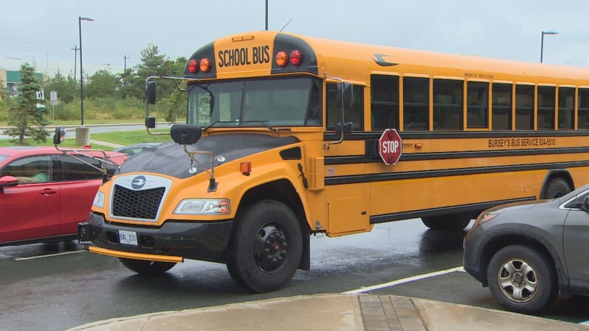 st-john-s-school-bus-1 A school bus sits in a parking lot.