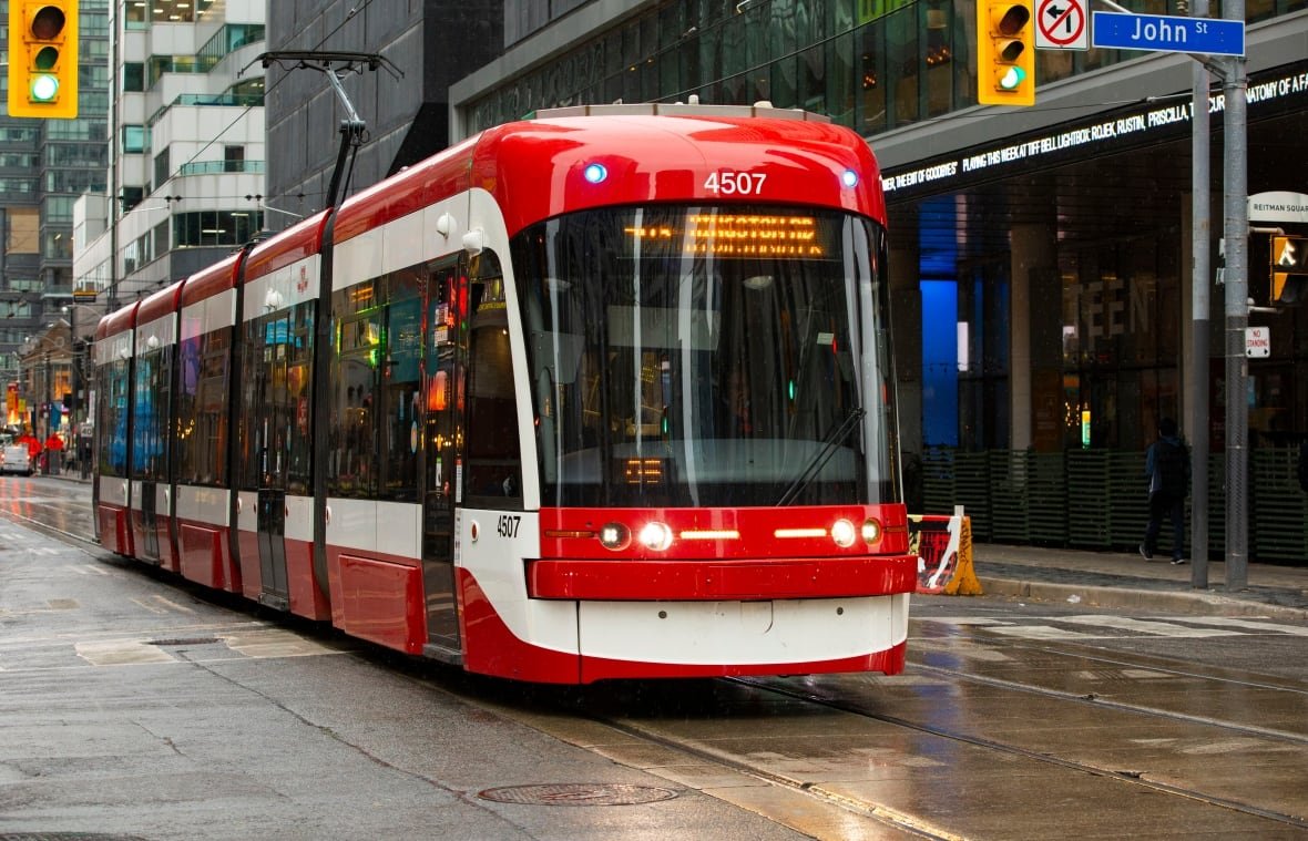 A streetcar at the corner of King and John Streets.