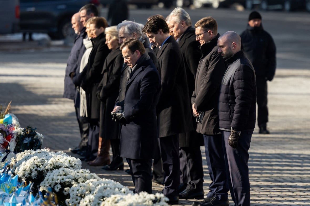 ukraine-crisis-anniversary-1 Ukraine's President Volodymyr Zelenskiy with his wife Olena, European Commission President Ursula von der Leyen, European Council President Antonio Costa, Canada's Prime Minister Justin Trudeau, Spanish Prime Minister Pedro Sanchez, Latvia's President Edgars Rinkevics, President of Lithuania Gitanas Nauseda, Estonian Prime Minister Kristen Michal, Denmark's Prime Minister Mette Frederiksen, Icelandic Prime Minister Kristrun Frostadottir, Norwegian Prime Minister Jonas Gahr Stoere, Finnish President Alexander Stubb, Sweden's Prime Minister Ulf Kristersson visit a makeshift memorial place displaying Ukrainian flags with the names of fallen service members, at the Independence Square.