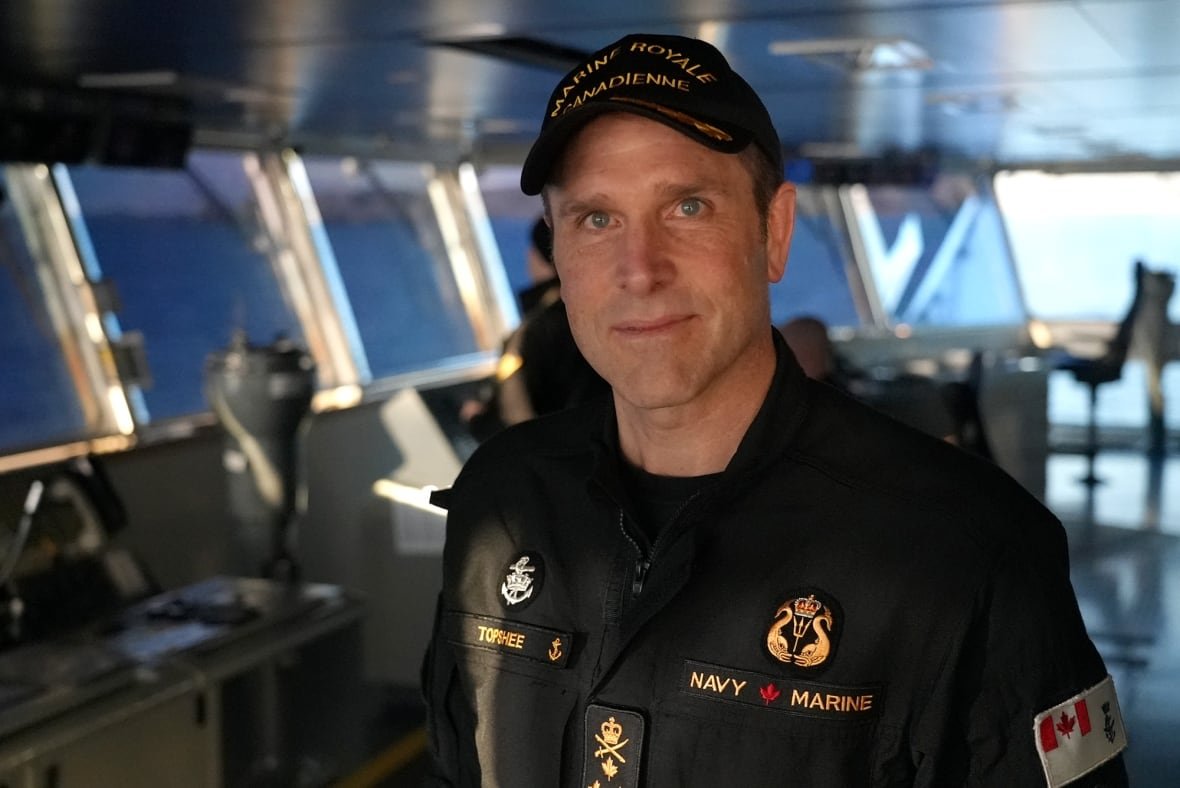 vice-admiral-angus-topshee-1 A man in the control room of a ship.