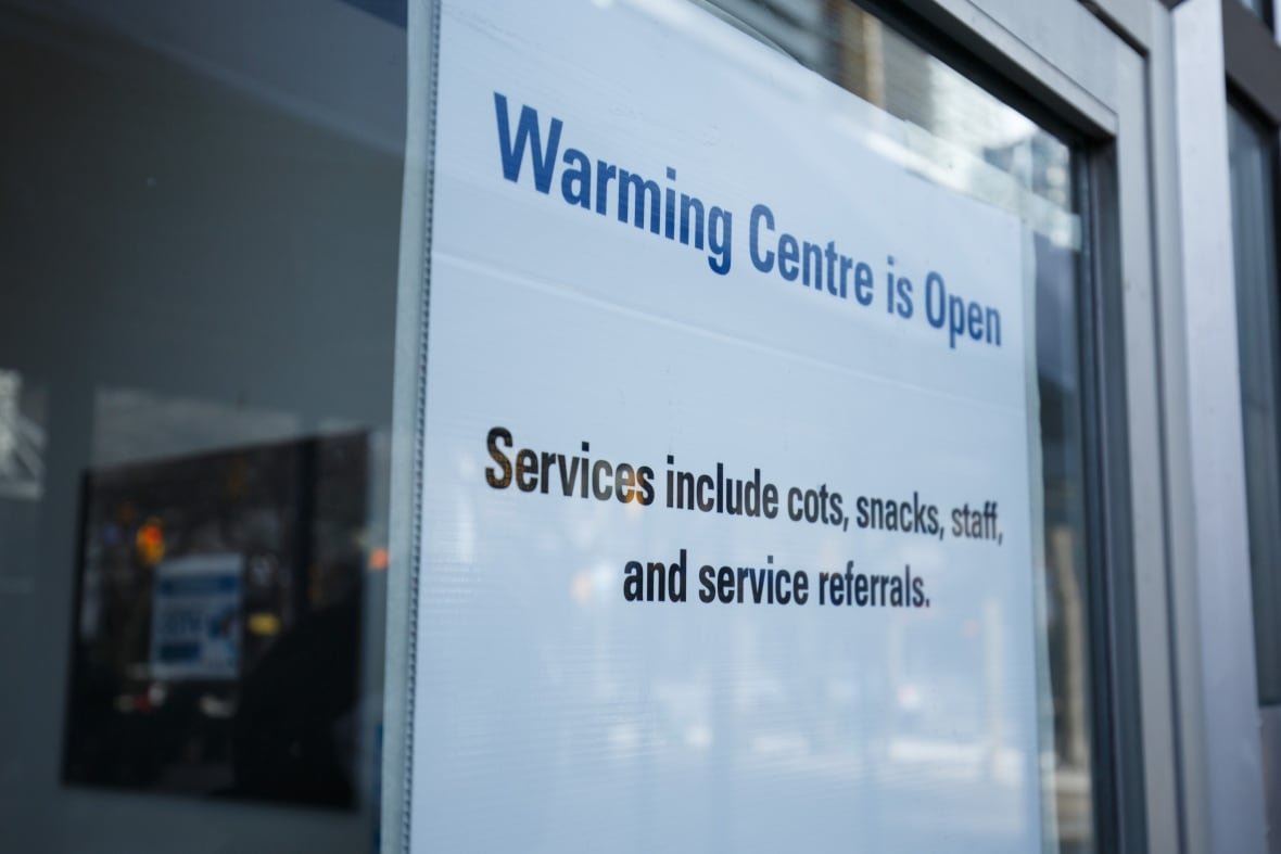 Signage for a warming centre is photographed at Metro Hall in Toronto, on Feb. 17, 2023.