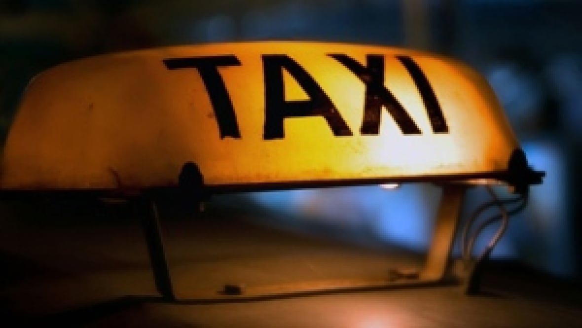 Yellow taxi sign.