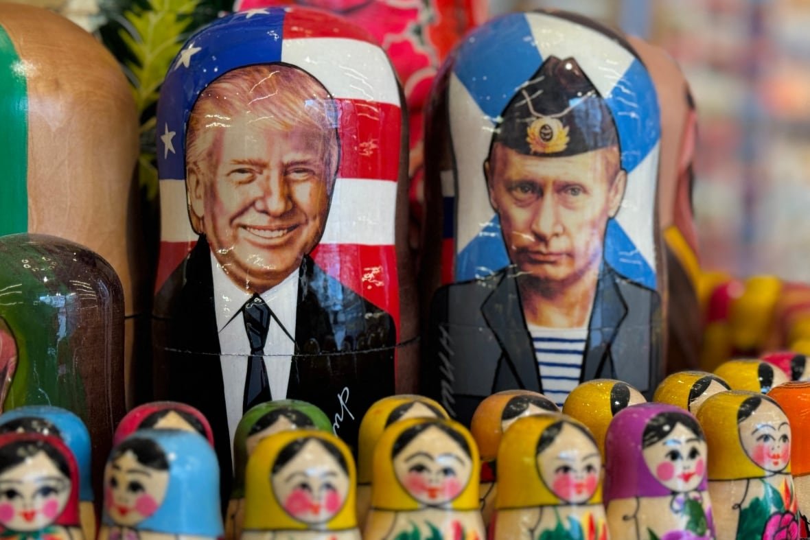2205265473 Traditional Russian wooden nesting dolls, Matryoshka dolls, depicting Russia's President Vladimir Putin and US President Donald Trump are displayed for sale at a gift shop on in downtown Moscow on March 19, 2025.