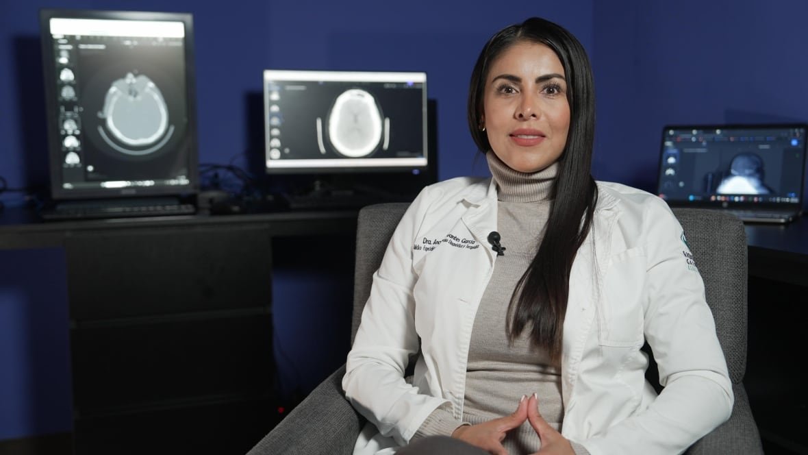 anabel-cervantes A doctor sitting inside an office.